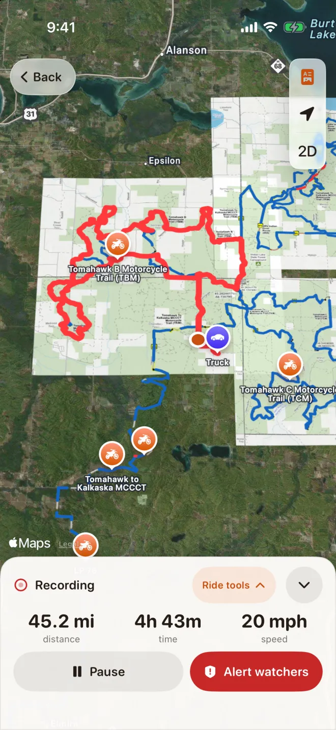 Live recording of a 45-mile Tomahawk trail day: the red breadcrumb drawn over the official DNR paper maps, the truck pin back at the start, and live distance, time and speed with Pause and Alert watchers